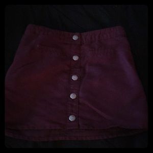 A maroon skirt